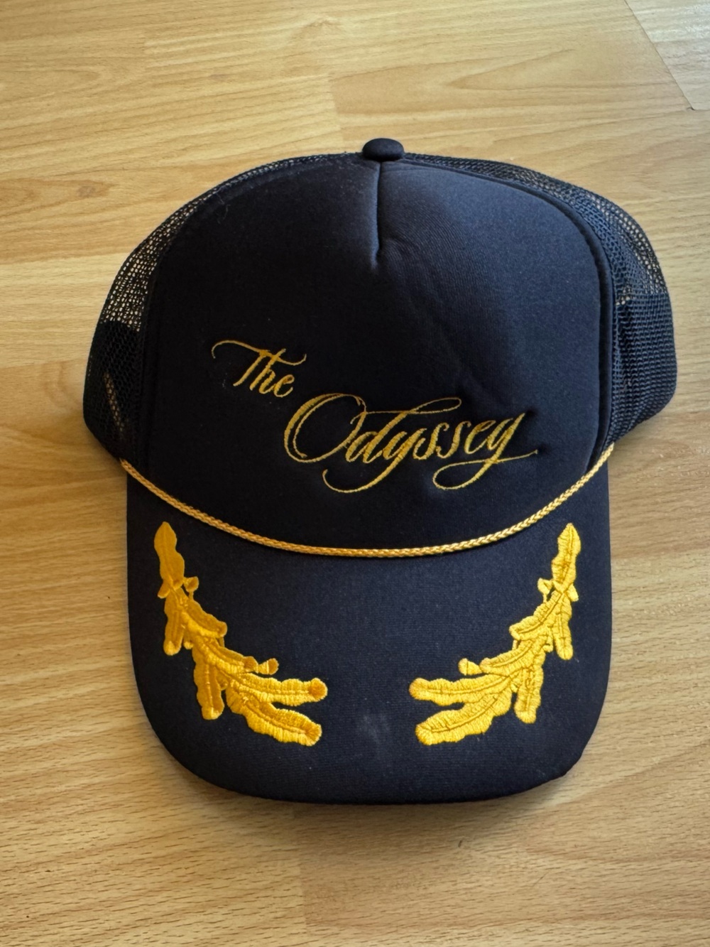 The Odyssey black trucker hat